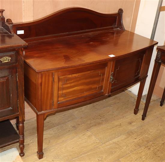A 1920s mahogany bow front wash stand W.116cm
